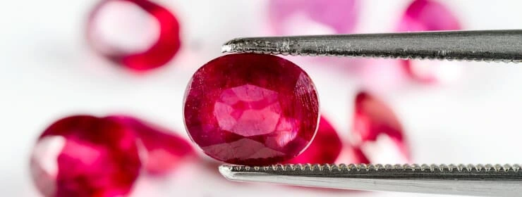 Ruby gemstone with tweezers