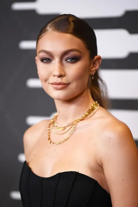 Model Gigi Hadid wearing layered Gold Necklaces